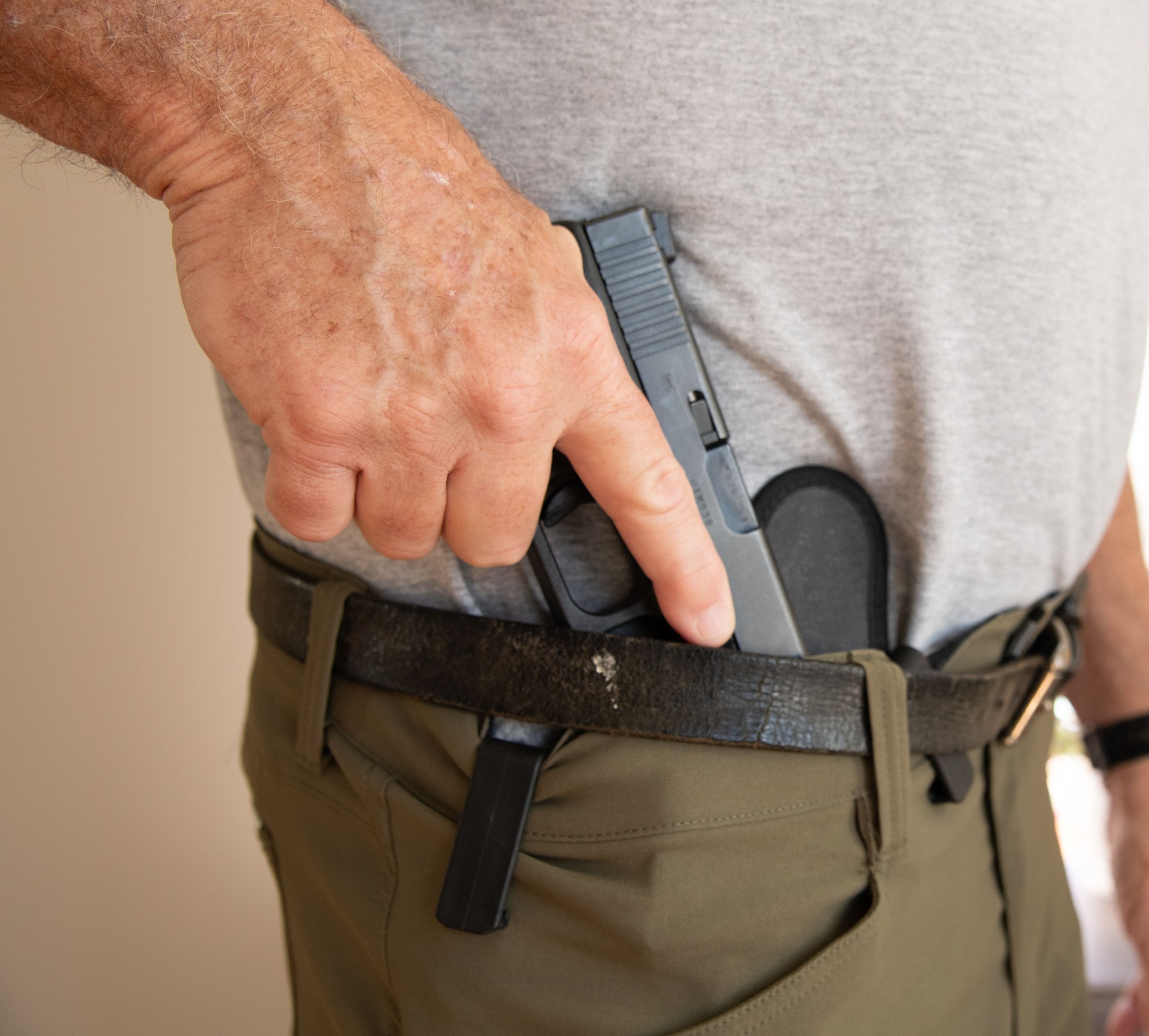 Drawing a handgun from a holster